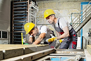 Two workers on a factory