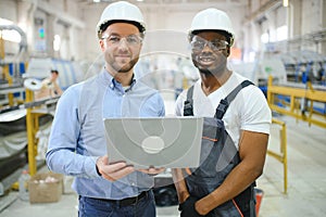 Two workers at the factory. Engineer and worker