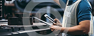 Two workers at an industrial plant with a tablet in hand and document plan, Engineer looking of working at industrial machinery