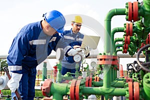 Two workers in the oilfield. Oil and gas concept