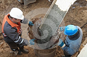 Two workers at piling