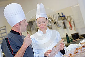 Two workers prepare chocolate