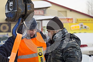 Two workers at the site of the ice camp