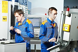 Two workers at tool workshop