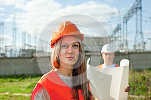 Two workers wearing protective helmet
