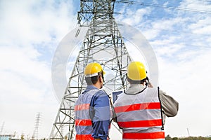 Two workers wearing protective helmet