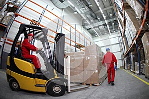 Two workers at work in storehouse