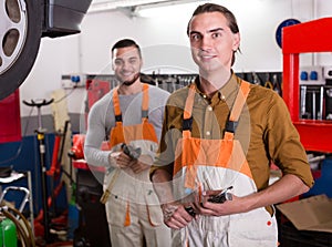 Two workmen toiling in workshop