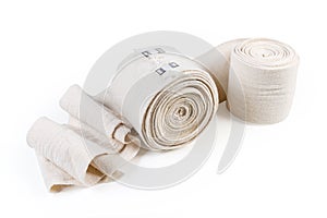 Two woven elastic medical bandages on a white background