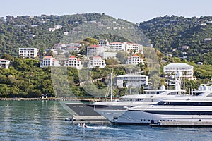 Two Yachts Below Tropical Homes