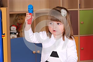 Two-year girl playing and learning in preschool