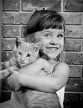 Two-year old girl with a kitty