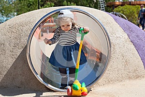 Two year old girl playing in the playground