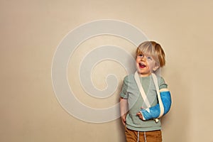 Two years old boy with broken hand in cast yet positive