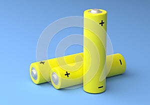 Two yellow AA size batteries isolated on blue background