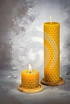 Two yellow beeswax candles