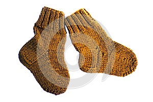 Two yellow children's wool socks isolated on white