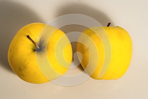 Two yellow juicy apples