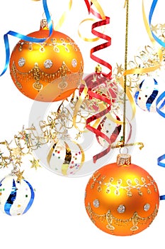 Two yellow New Year's spheres on a background of a tinsel