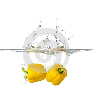 Two Yellow Paprika Splash in Water