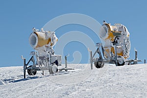 Two yellow snow guns