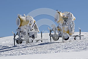 Two yellow snow guns
