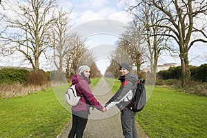 Two young adults smiling looking at camera