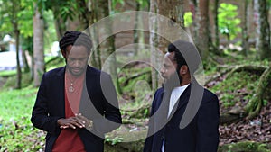 Two Young African Man Doing a Conversation While Walking in the Nature