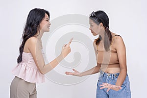 Two young asian arguing with each other, blaming each other for their problems. A rift or disagreement between two friends.