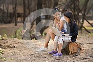 Two young Asian girl study in outdoor