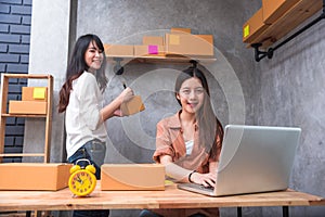 Two young Asian people startup small business entrepreneur SME d