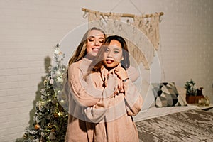 Two young asian women smiling with happiness in Christmas party, lgbt couple, friends celebration