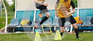 Two young athletes on soccer training drill. Football camp practice activities for players
