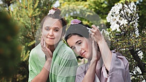 Two young beautiful women in Japanese Garden