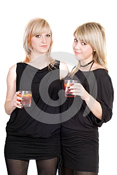 Two young beauty blonde with cocktails.