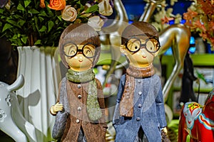 Two young, bespectacled figures in the shop