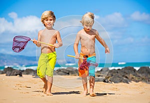 Two young boys having fun on tropcial beach