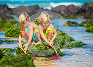Two young boys having fun on tropcial beach