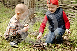 Two young boys playing with matches