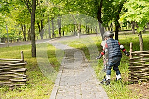 Two young boys in roller blades