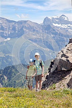 Two young boys in the summer mountains