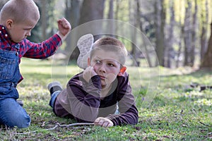 Two young brothers quarreling  in the Park