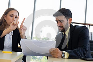 Two young business men, men and women, Dew, work at the office with seriousness