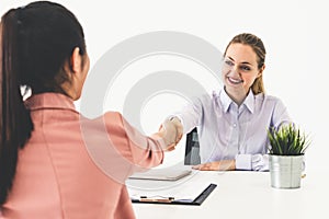 Two young business women meeting for interview.