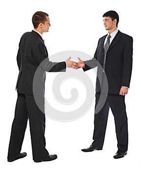 Two young businessmen greet