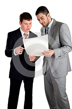 Two young businessmen working and confer