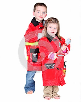 Two young children dressed as firemen