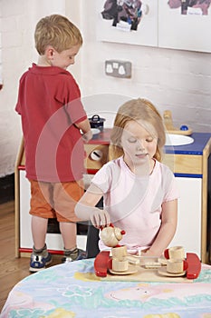 Two Young Children Playing Together at Montessori/