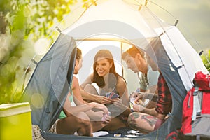 Two young couple having fun on camping trip