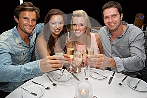 Two young couples in restaurant